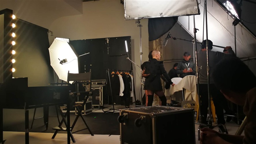 Chongqing production crew reviewing a shoot on location